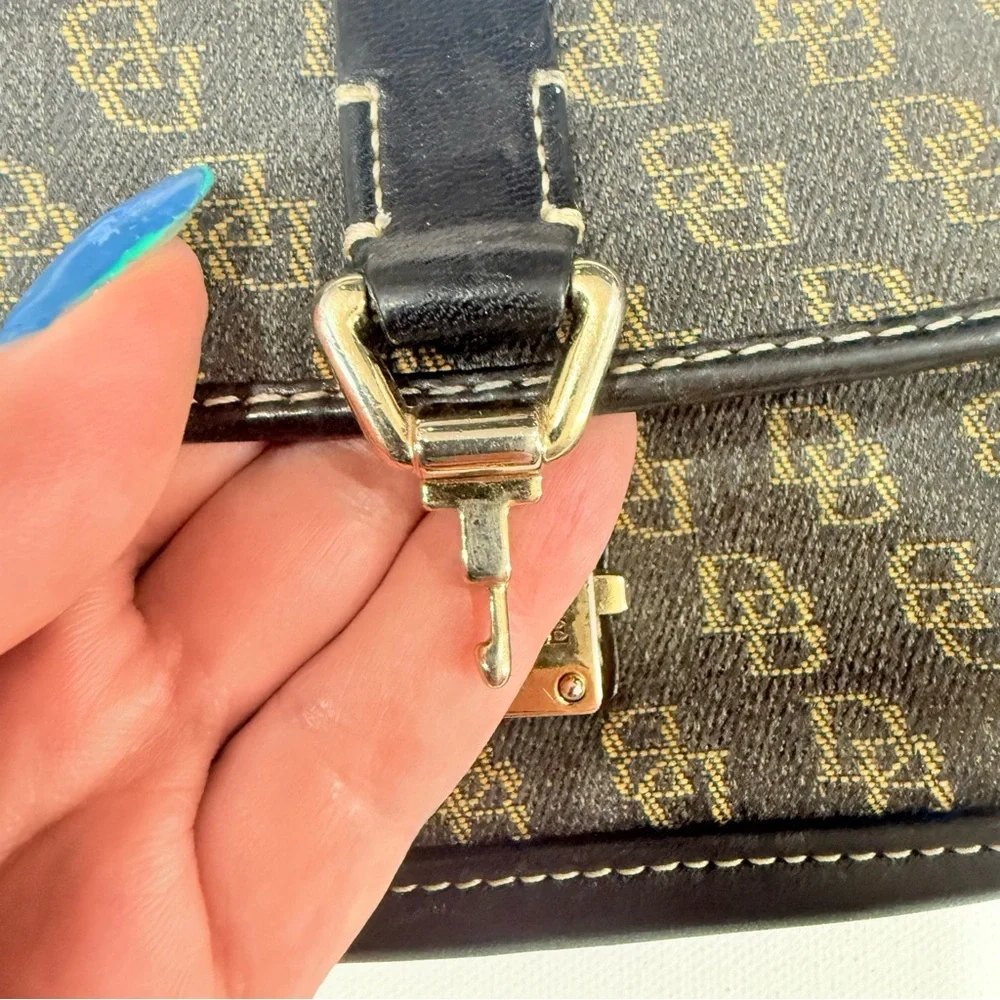 Dooney & Bourke Monogrammed Tan and Black Wristlet Clutch